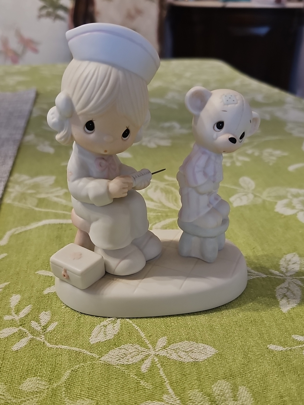 Precious Moments Nurse Figurine with Teddy — White and Pink Accents